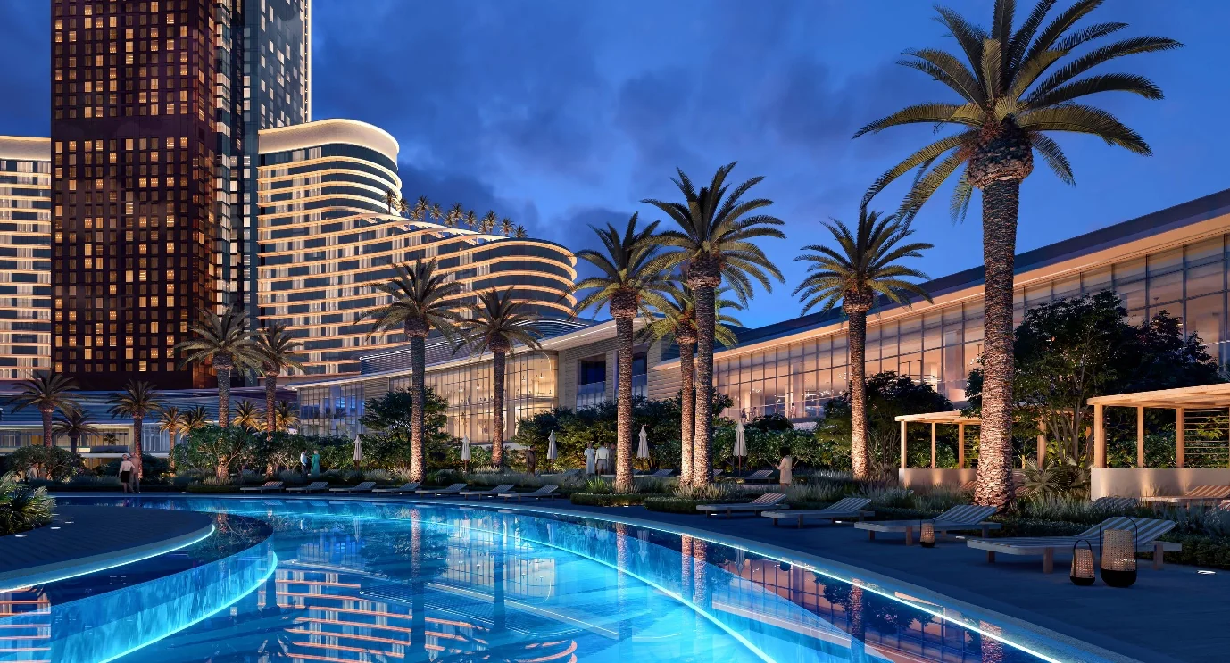 Wynn Al Marjan Island resort tower and pool at dusk